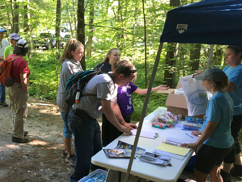 Volunteers greeting hikers